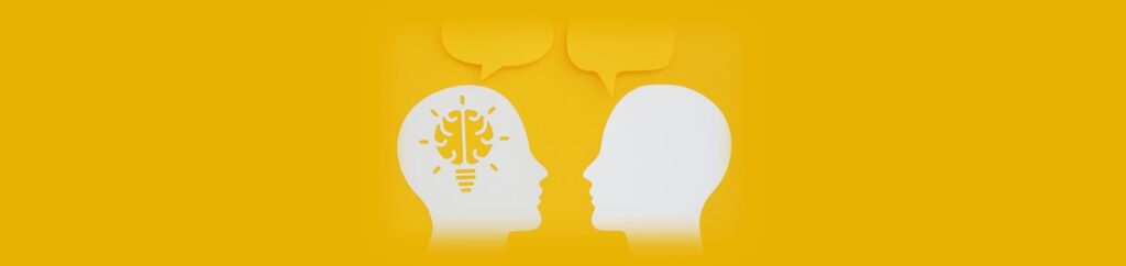 Ilustração de dois rostos humanos de perfil, um de frente para o outro, com balões de diálogo e uma lâmpada acesa dentro de uma das cabeças.